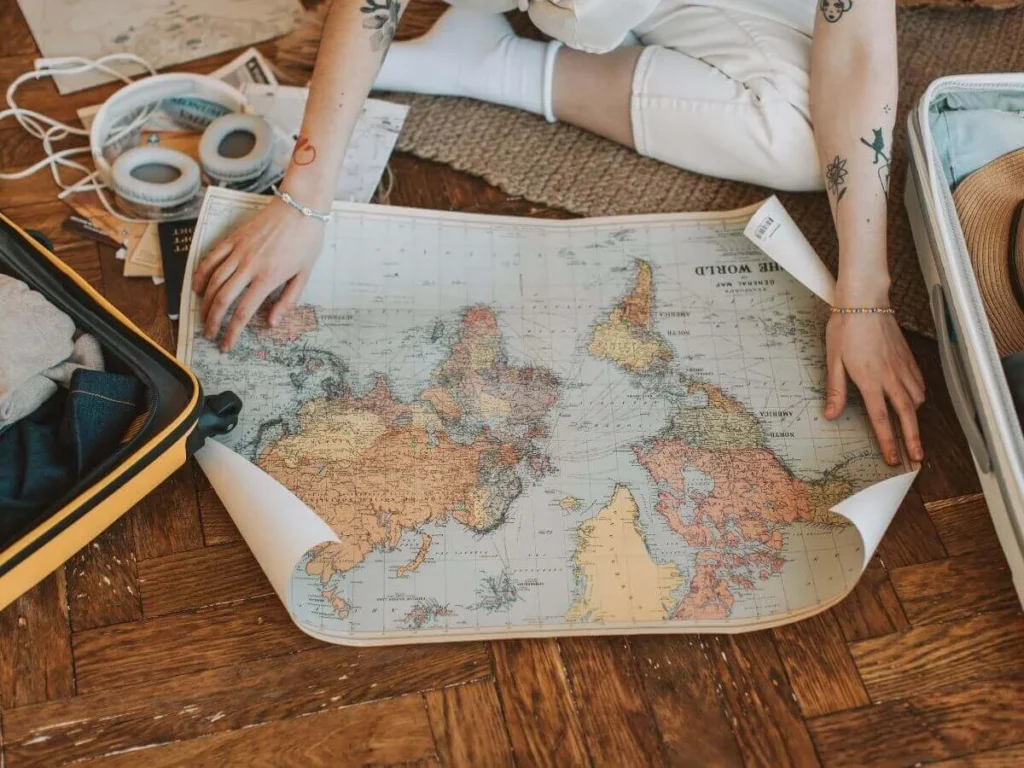 A person looking at a map while planning a trip